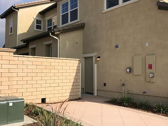 SIDE OF GARAGE / ADJACENT PARKING