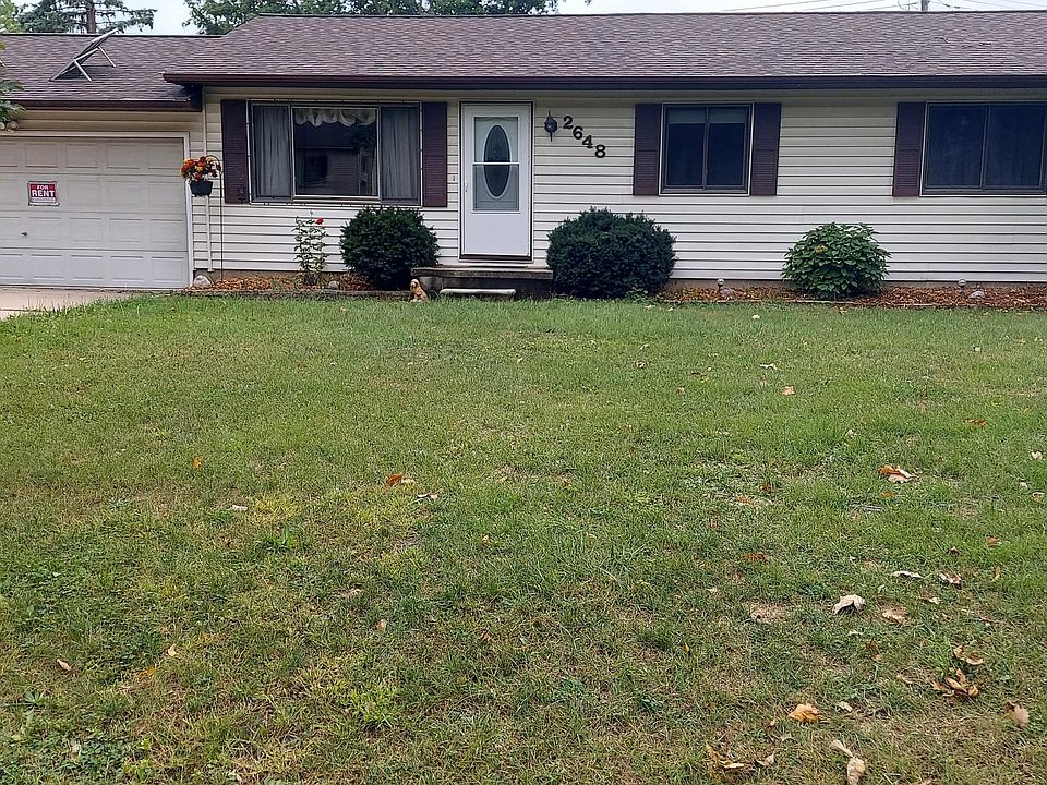 Front yard showing attached garage.