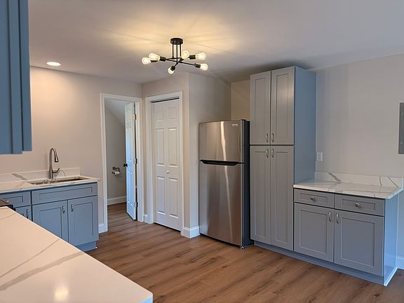 KITCHEN - all brand new appliances, fixtures and finishes, windows. Huge kitchen with lots of cabinet/storage space, quartz countertops and wonderful lighting.