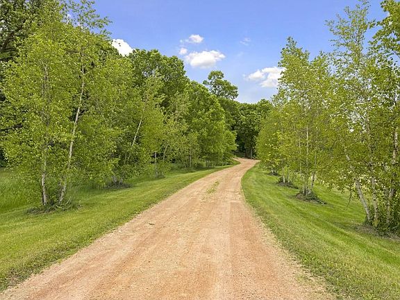 Long winding driveway, splits off just before house and leads to outbuilding. Perfect for home based business.