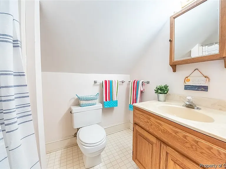 Full bathroom located in above garage suite