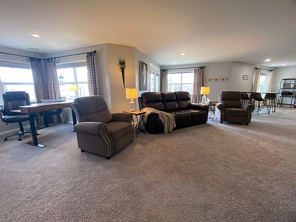 Bright natural light in living space with office nook.