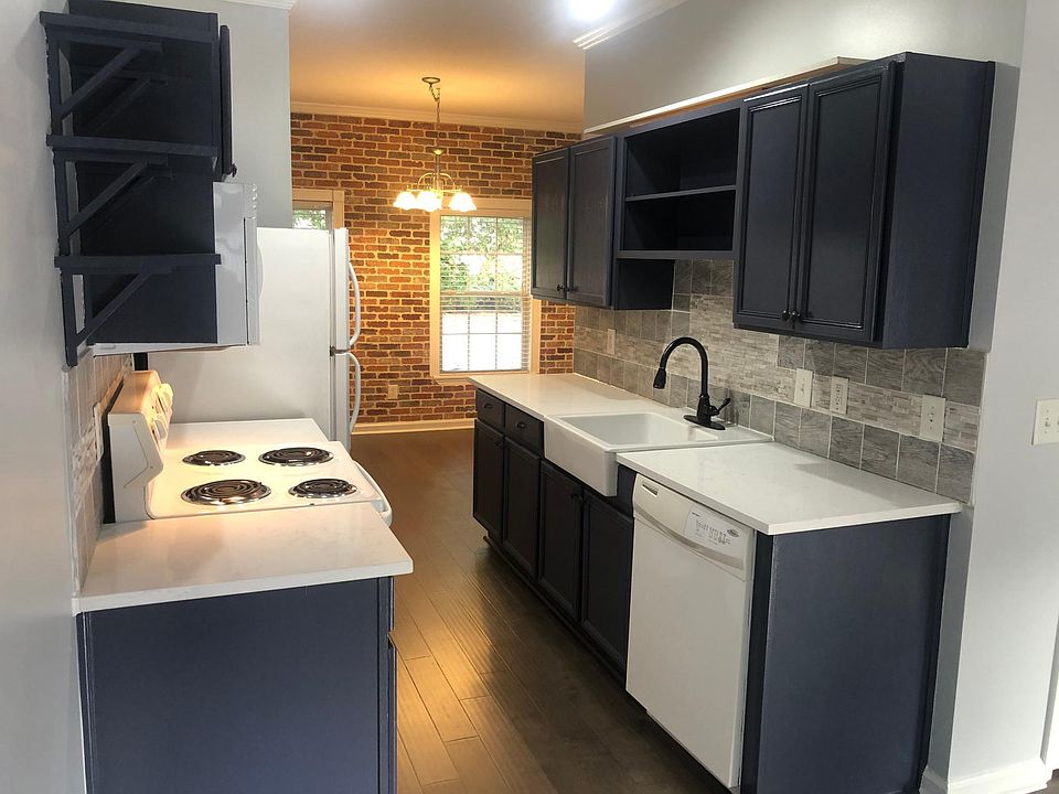 Newly renovated kitchen. Farmhouse kitchen sink and style. Quartz countertops and freshly painted cabinets
