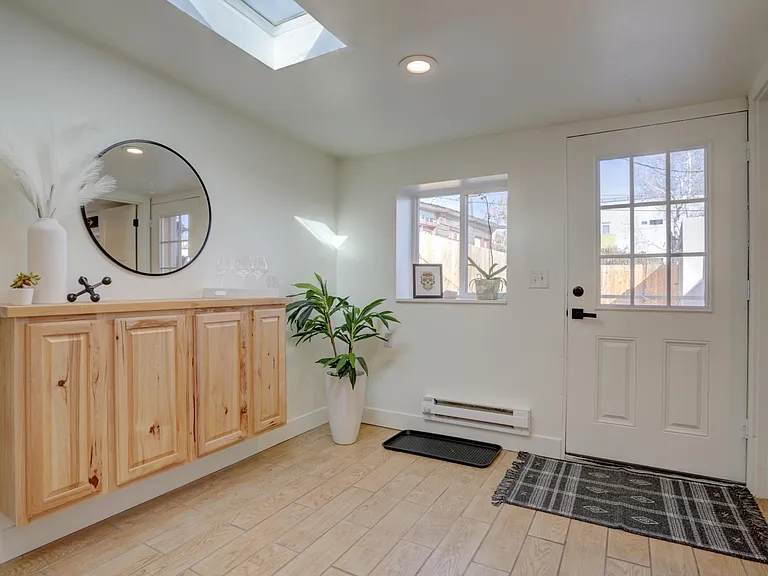 Room off the kitchen with door to private fenced yard.