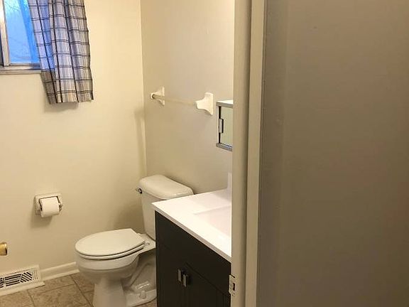 Full bath has new vanity, toilet and shower surround
