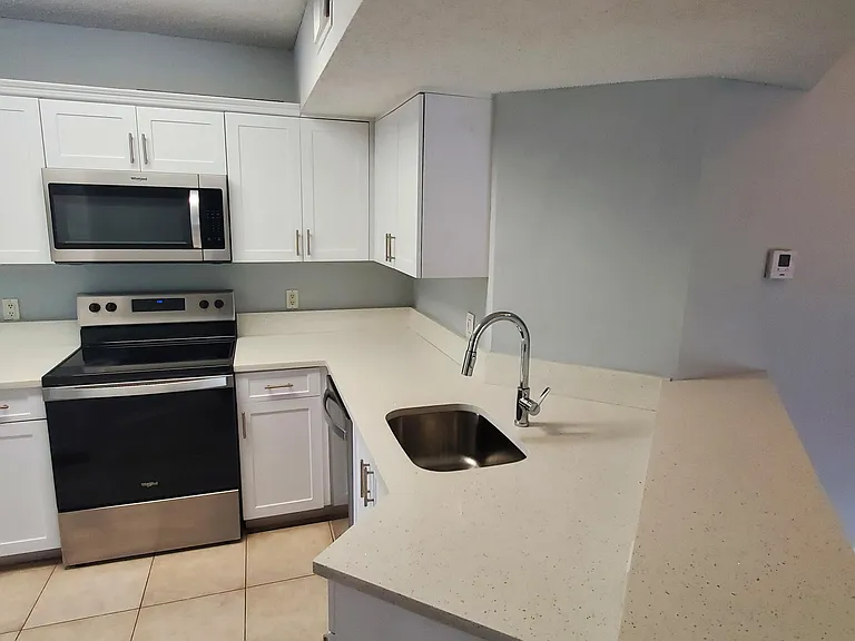 9033 Wiles Rd #308 — Photo 8