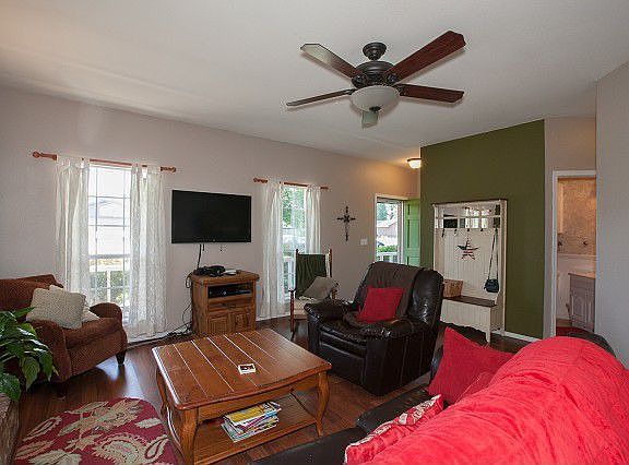 Living room features bright windows