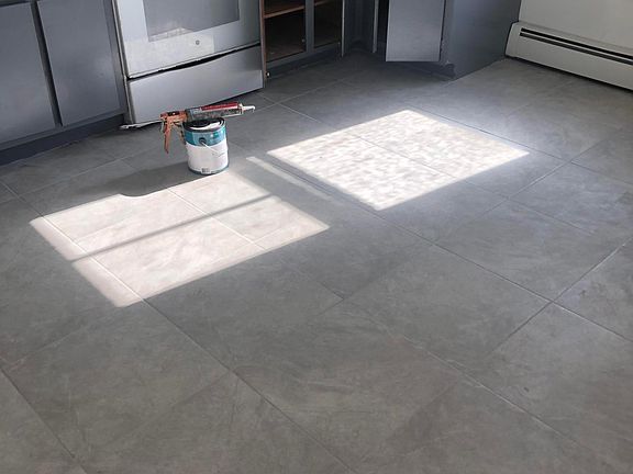 Freshly painted cabinets and brand new tile floor!
