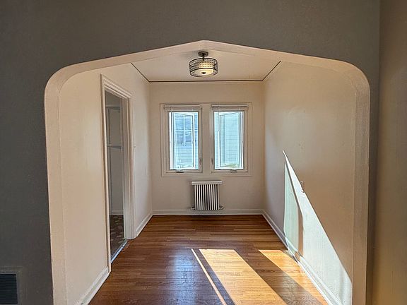 Dining room with a classic arch.