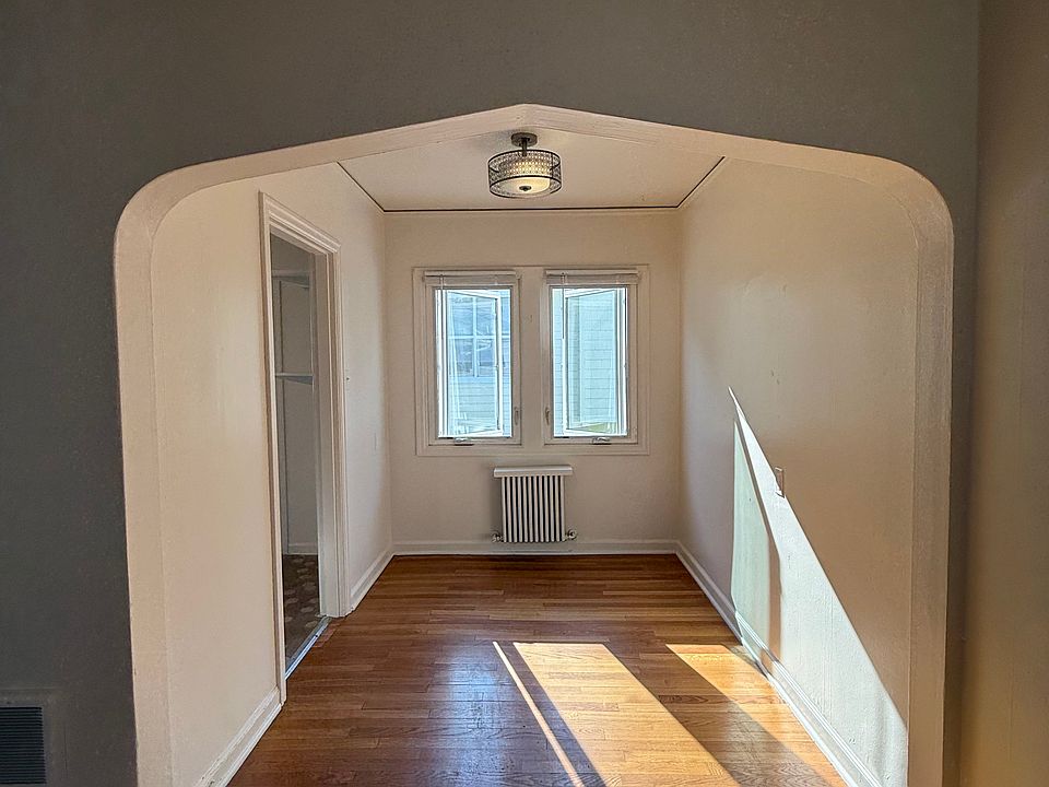 Dining room with a classic arch.