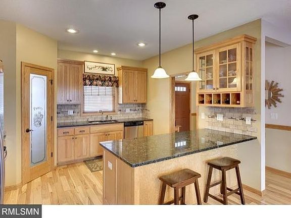 Gorgeous custom kitchen, granite counters, stone backsplash, stainless steel appliances.
