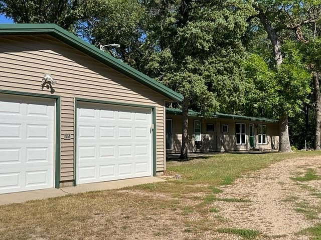 Double garage with electric garage doors. There is also a back room for storage.