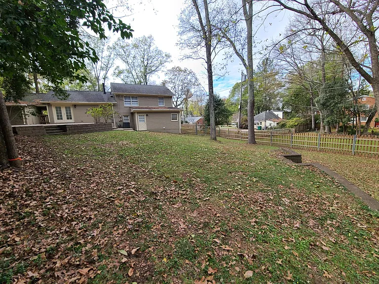 I love the back yard. There's even more forested space on the lot behind the fenced in back yard. I will maintain the forested area and plan on planting back there in the Fall to provide a cool private area beside the small stream.