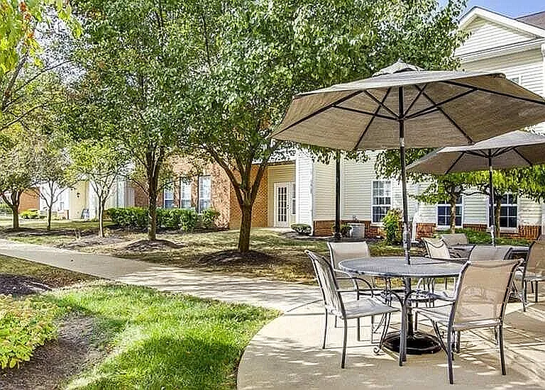 From patio to pathway: step right into the courtyard and enjoy a peaceful stroll under the trees, just beyond your favorite outdoor hangout.