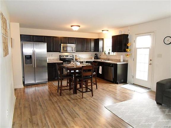 Ample Kitchen counter & cabinet space. Stainless appliances. REFRIGERATOR TO STAY!