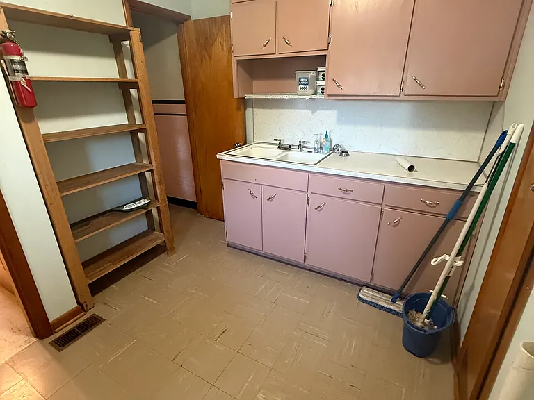 Laundry room and additional storage and work space.