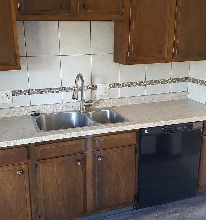 Kitchen with tile and accent