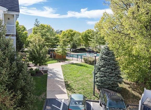 Your private deck looks out to trees and the pool.