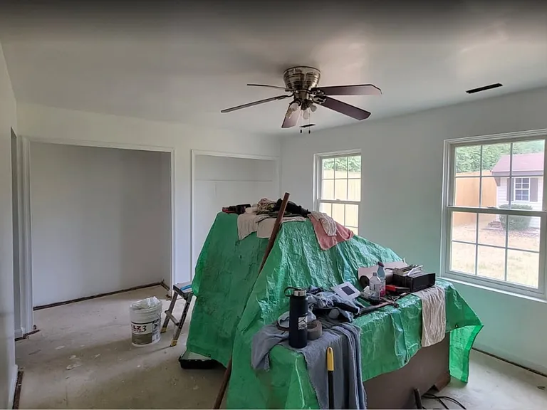 Primary Bedroom - Not complete yet. Carpeting and Closet Doors will be put on and lighting fixture is updated.