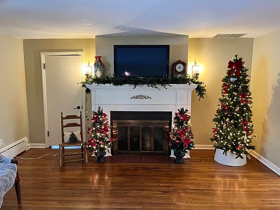 Opposite end of living room with fireplace