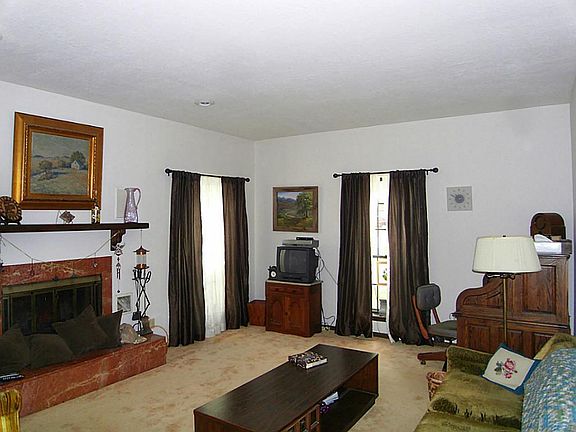 The formal living room has a Heatilater fireplace-perfect for those chilly winter nights.