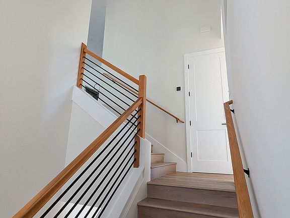 Walking upstairs primary bedroom to the right. Kitchen, Living and dinning room to the left. 1/2 bath to the right.