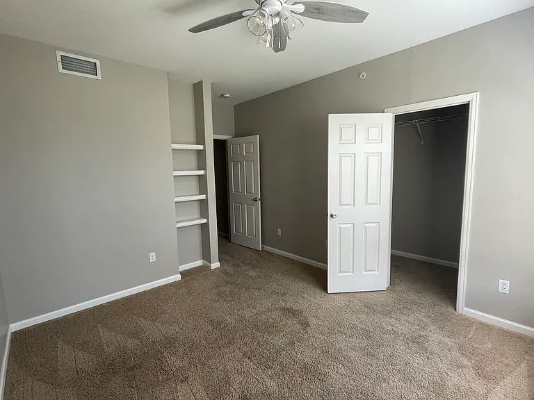 Second bedroom with a walk-in closet