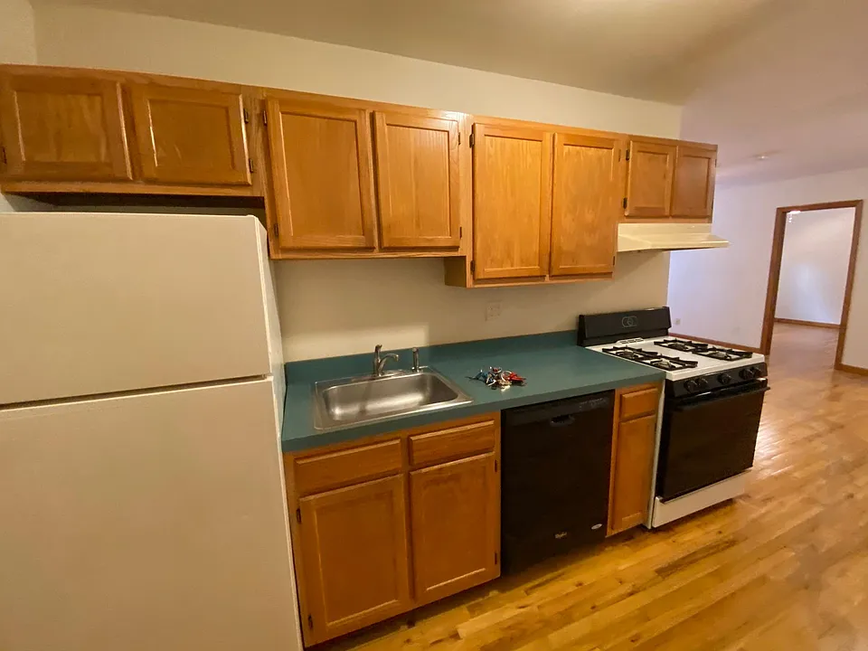Kitchen with gas range, dishwasher & refrigerator