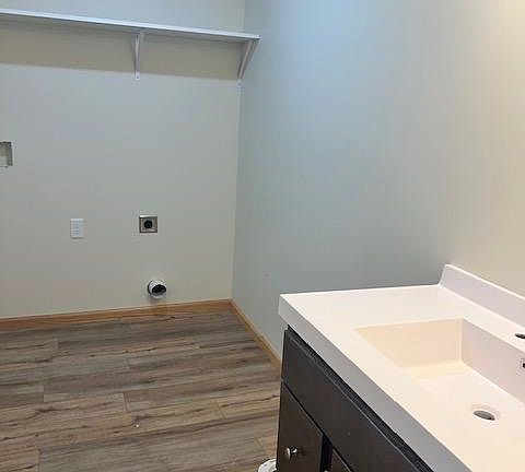 first floor half bath with washer and dryer hook up.