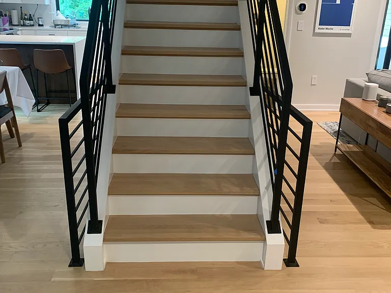 Stairs leading to four upstairs rooms and two full baths. Two rooms are in the middle of remodeling so pictures are dated. New ones will be posted soon.