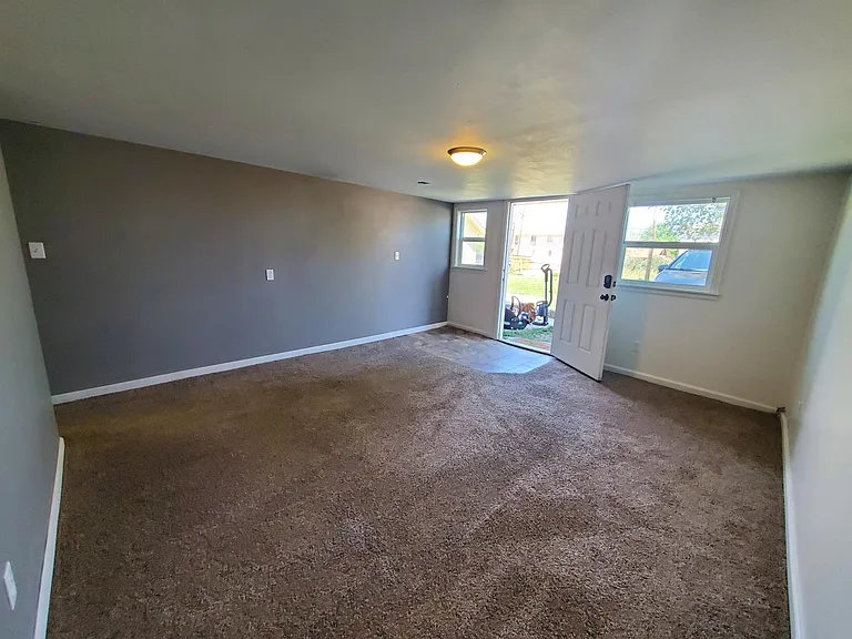 Natural light in living room. Plenty of outlets.