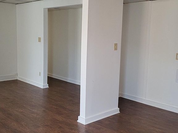 From kitchen looking towards living room and entrance to hallway. Washer & dryer hook-ups in apartment.