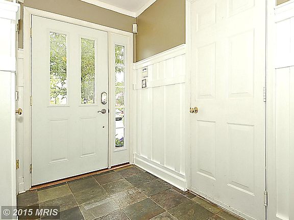 Beautiful wainscoting and Tile in Entry Foyer.