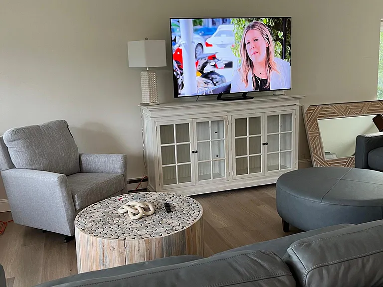 Living room with large smart tv.