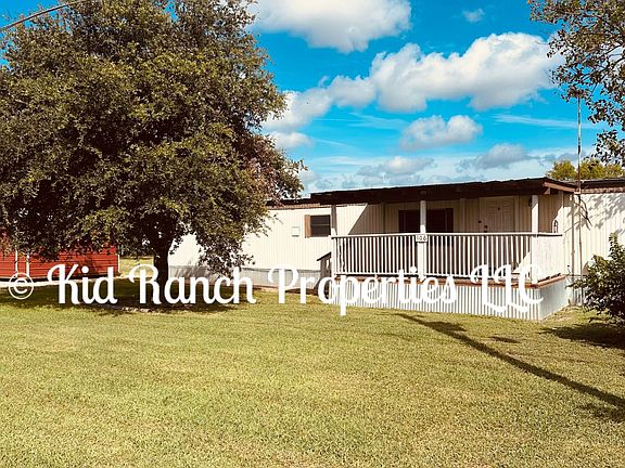 Front Of Home Also Has Beautiful Shade Tree...