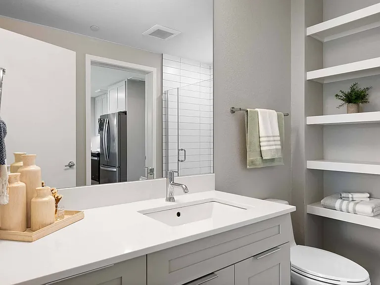 Relax in a modern bathroom with sleek fixtures and a clean, minimalist design.