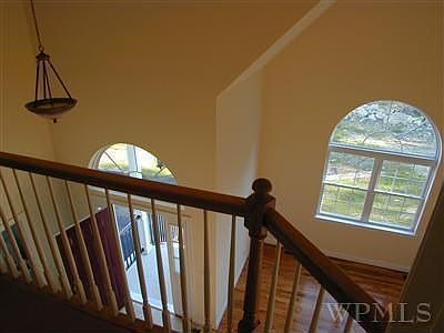 Marble Entry & Cathedral Living Room