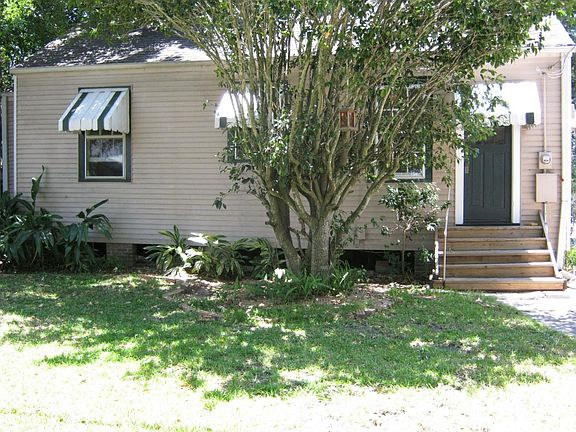 partly shaded back yard keeps utility bills down