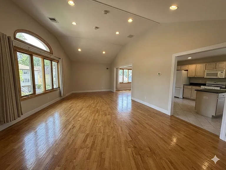 Living room / family room with high ceiling