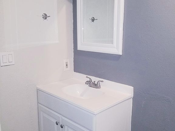 Bathroom, vanity and mirror.