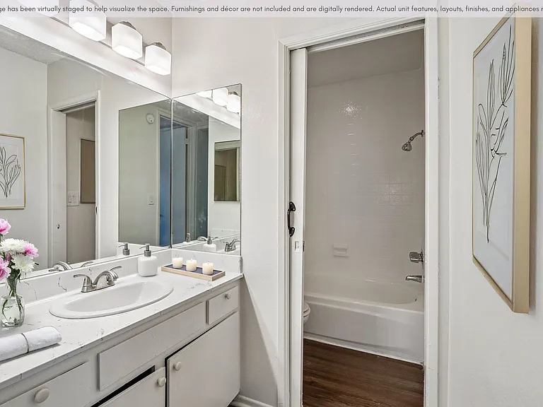 Bathroom with bright vanity mirror and an abundance of counter space.