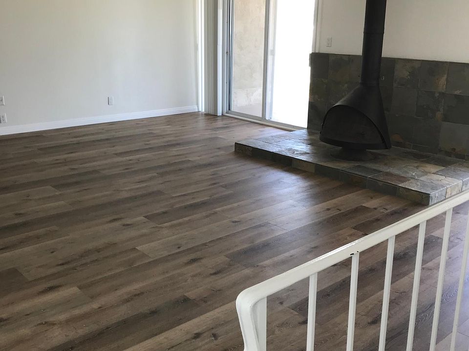 Living room and fire place from entry stairs