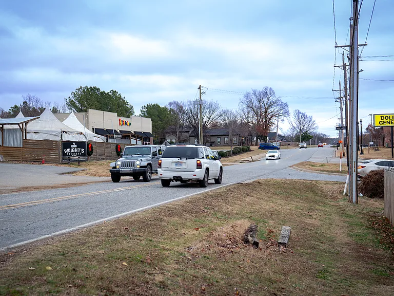 Road right new to the house, Wright BBQ on the Right and Dollar General in the back of the house
