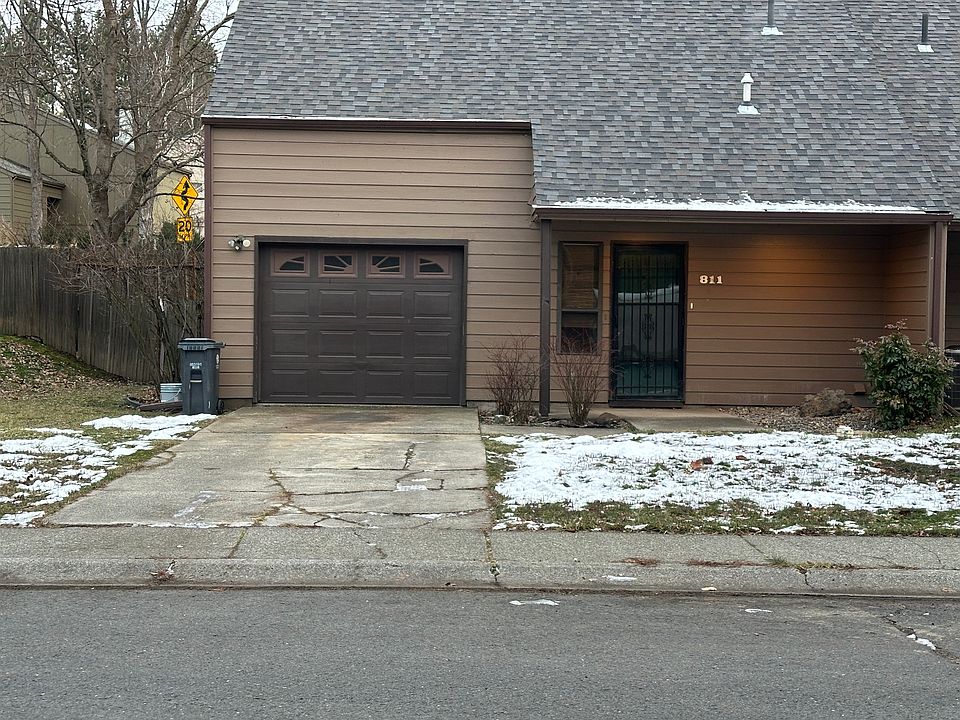Front view with attached one car garage.