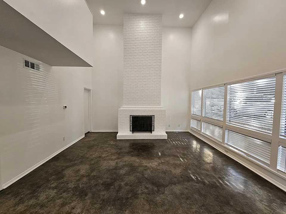 The living space boasts 16 foot ceilings and a gas log fireplace