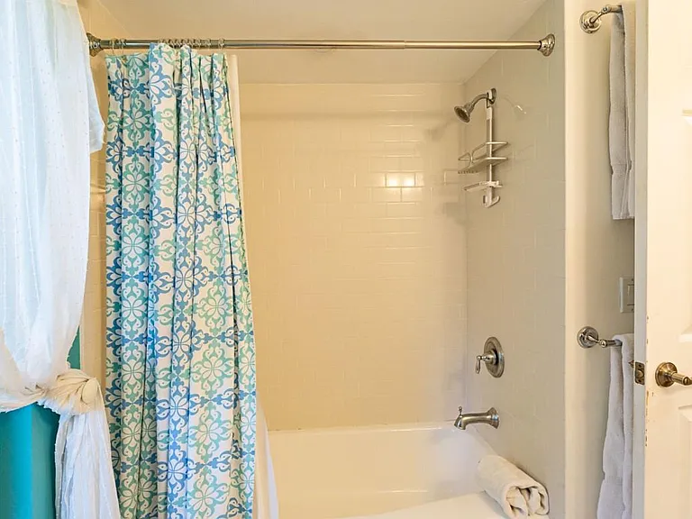 Second bathroom with view of tub