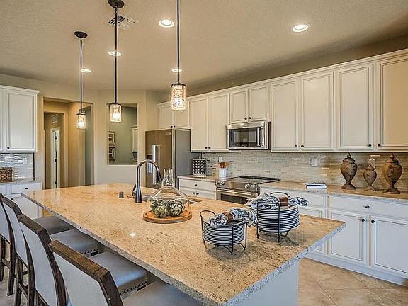 Breakfast bar allows for seating at the kitchen island.