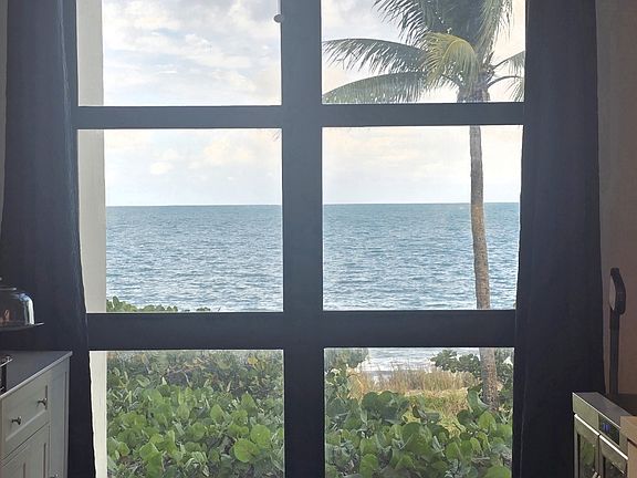 TKB A02 - Fabulous view of ocean, beach and Palm trees swaying in the wind from the Kitchen, Living & Dining rooms.
