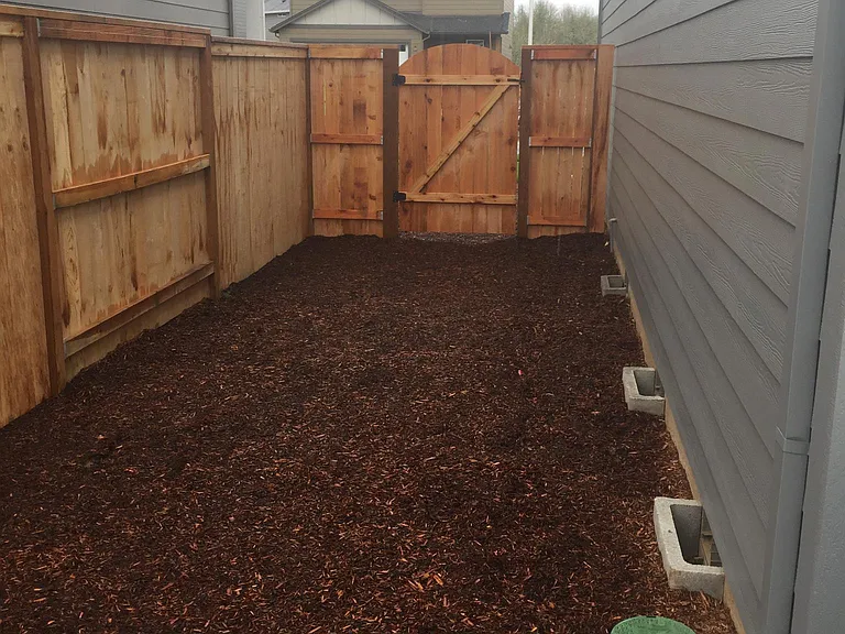 Side yard. Rear fence included. HOA maintained front landscape with water sprinkler.