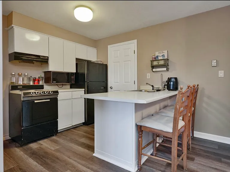 Old kitchen: currently being renovated with all new cabinets and stainless steel appliances.